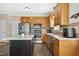Well-equipped kitchen with stainless steel appliances, natural cabinets and an island at 1421 Harvey Johnson Rd, Raleigh, NC 27603