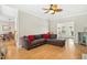 Cozy living room features a large sectional sofa and seamlessly connects to the dining area at 1421 Harvey Johnson Rd, Raleigh, NC 27603