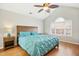 Spacious main bedroom with natural light, hardwood floors and wooden furniture at 1421 Harvey Johnson Rd, Raleigh, NC 27603