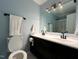 Modern bathroom featuring dual sinks, contemporary lighting, and a sleek design at 1517 Peace St, Henderson, NC 27536