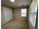 Bedroom with neutral walls and natural lighting offers a peaceful retreat within the home at 1517 Peace St, Henderson, NC 27536