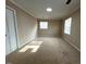 Bright, carpeted bedroom with natural light and a neutral color palette, creating a peaceful space at 1517 Peace St, Henderson, NC 27536