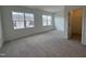 Large bedroom with carpet flooring and views to other new construction homes at 1581 Wendell Valley Blvd, Wendell, NC 27591