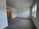 Spacious bedroom with carpeting, neutral walls, and a large window for ample natural light at 1581 Wendell Valley Blvd, Wendell, NC 27591