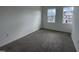 Cozy carpeted bedroom with bright, naturally lit with a view of the neighborhood at 1581 Wendell Valley Blvd, Wendell, NC 27591