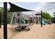 A fun playground with a picnic table and modern play structures in a community park at 1581 Wendell Valley Blvd, Wendell, NC 27591