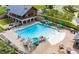 A large swimming pool with a slide, splash pad, and ample seating for residents at 1581 Wendell Valley Blvd, Wendell, NC 27591