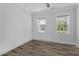 Inviting bedroom with ample natural light and hardwood flooring at 163 English Violet Lane Ln, Raleigh, NC 27610
