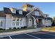 The community clubhouse has stone accents, black roof, and well-manicured landscaping at 163 English Violet Lane Ln, Raleigh, NC 27610