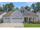 Charming single-Gathering home with a two-car garage, well-manicured lawn and covered porch at 163 English Violet Lane Ln, Raleigh, NC 27610