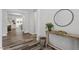 Bright hallway featuring hardwood floors, stylish decor, and an open floor plan at 163 English Violet Lane Ln, Raleigh, NC 27610