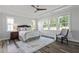 Relaxing bedroom with tray ceiling, neutral decor, lots of windows and an abundance of natural light at 163 English Violet Lane Ln, Raleigh, NC 27610