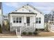Charming single-story home with white siding, a stone foundation, and a welcoming front porch at 1737 Fence Post Rd, Wendell, NC 27591