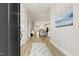 Spacious hallway with an open floor plan, neutral paint, and luxury vinyl plank flooring at 1737 Fence Post Rd, Wendell, NC 27591