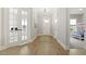 Inviting hallway features luxury vinyl floors and a view of a bedroom or play area at 1737 Fence Post Rd, Wendell, NC 27591