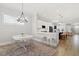 Open-concept kitchen with modern island, counter seating, and an adjacent breakfast nook for casual dining at 1737 Fence Post Rd, Wendell, NC 27591
