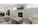 Cozy living room with an open floor plan, natural light, and hardwood floors at 1737 Fence Post Rd, Wendell, NC 27591