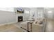 Bright living room with an open floor plan, neutral tones, and a modern fireplace with decor at 1737 Fence Post Rd, Wendell, NC 27591