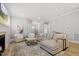Bright living room featuring hardwood floors, fireplace, and modern decor at 1737 Fence Post Rd, Wendell, NC 27591