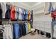 Organized walk-in closet with shelving, drawers, and ample hanging space for clothing and accessories at 1737 Fence Post Rd, Wendell, NC 27591