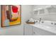 Convenient laundry room with modern appliances, open shelving and decorative touches at 176 Ethel Ln, Angier, NC 27501