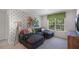 Bright and airy living room with a large sectional sofa and graphic accent wall at 176 Ethel Ln, Angier, NC 27501