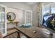 Bright home office featuring french doors, and a modern desk setup perfect for productivity at 176 Ethel Ln, Angier, NC 27501