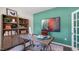 Stylish office featuring a wooden desk, open shelving, and a comfortable chair at 176 Ethel Ln, Angier, NC 27501