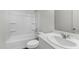Clean bathroom with a shower-tub combo, vanity with sink, and plenty of space at 209 Swift Park Dr, Zebulon, NC 27597