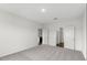 Bright bedroom with neutral carpet and an ensuite bathroom and closet at 209 Swift Park Dr, Zebulon, NC 27597