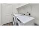 Bright laundry room with newer, front-loading washer and dryer at 209 Swift Park Dr, Zebulon, NC 27597