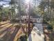 Aerial view of a brick home with mature trees, long drive, and established landscaping at 2201 Knollwood Dr, Sanford, NC 27330