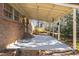 A spacious back patio area extends from the brick home, great for entertaining at 2201 Knollwood Dr, Sanford, NC 27330