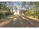 Expansive backyard surrounded by lush trees, providing privacy and a serene outdoor space at 2201 Knollwood Dr, Sanford, NC 27330