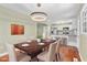 Elegant dining room with a modern chandelier, view of the kitchen, and seating for six guests at 2201 Knollwood Dr, Sanford, NC 27330