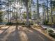 Brick home with a classic design, surrounded by mature trees creating a serene setting at 2201 Knollwood Dr, Sanford, NC 27330
