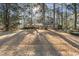 The property is surrounded by mature trees and a sprawling front yard at 2201 Knollwood Dr, Sanford, NC 27330