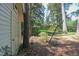 The side yard of the house features a shed and mature trees at 2201 Knollwood Dr, Sanford, NC 27330