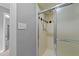 Shower featuring glass door and tile, located inside a main bathroom at 2301 Pastille Ln, Raleigh, NC 27612