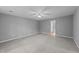 Large bedroom with neutral carpet and paint, ceiling fan and neutral decor at 2301 Pastille Ln, Raleigh, NC 27612