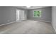 Bedroom featuring neutral carpet and paint, offering a serene and adaptable living space at 2301 Pastille Ln, Raleigh, NC 27612