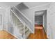 Entryway with carpeted stairs, wood floors, and freshly painted walls at 2301 Pastille Ln, Raleigh, NC 27612