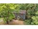 Classic two-story home with red shutters nestled among mature trees offering charm and privacy at 2301 Pastille Ln, Raleigh, NC 27612