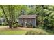Charming two-story home with red shutters surrounded by lush greenery, creating a serene and inviting atmosphere at 2301 Pastille Ln, Raleigh, NC 27612