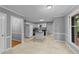 Well-lit kitchen with white cabinetry, black countertops, and tile flooring offering a clean and modern space at 2301 Pastille Ln, Raleigh, NC 27612