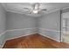 Bright living room featuring hardwood floors, ceiling fan, and neutral paint at 2301 Pastille Ln, Raleigh, NC 27612