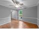 Living room boasting hardwood floors, natural light, neutral paint, and outside view at 2301 Pastille Ln, Raleigh, NC 27612
