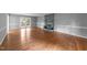Spacious living room with wood floors, a fireplace and French doors to the deck at 2301 Pastille Ln, Raleigh, NC 27612