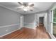 Open living room with hardwood floors and plenty of natural light at 2301 Pastille Ln, Raleigh, NC 27612
