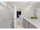 Bright bathroom features a glass shower, dual vanity sinks, and neutral decor at 251 Olde Pl, Zebulon, NC 27597